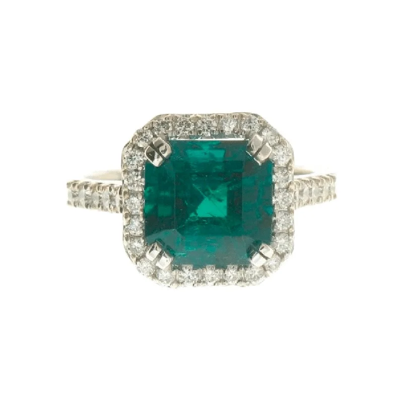 The Perfect Jewelry Piece At The Perfect Price Emerald and Diamond Halo Ring