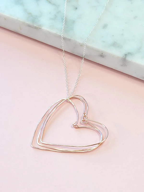 Rose Gold Hearts Necklace on a Silver Chain